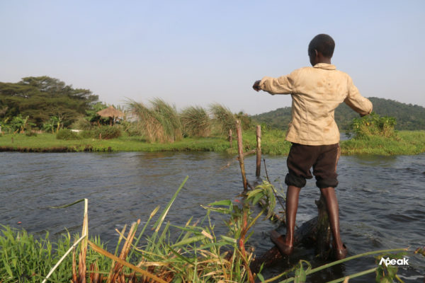 Kakande prepairing to lay his bait on the waters. Photo by Watsemba Miriam.