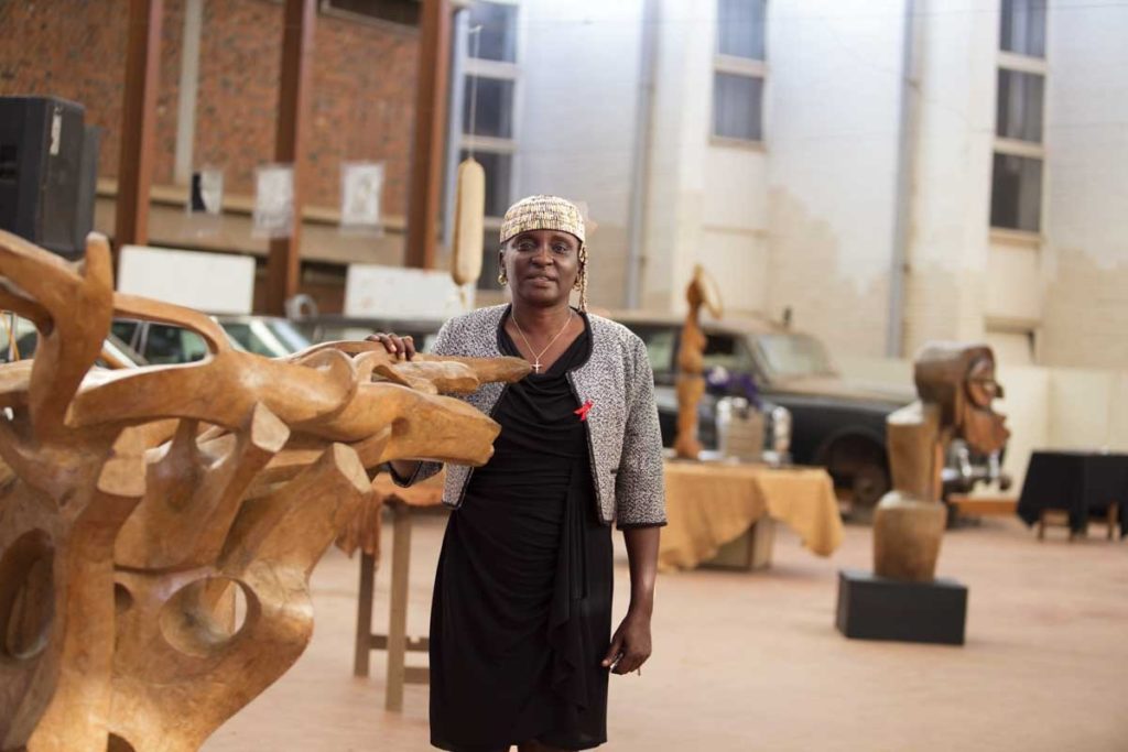 Dr. Nabulime Lilian poses for a photograph at the exhibition of her work in the Uganda Museum, 2019.